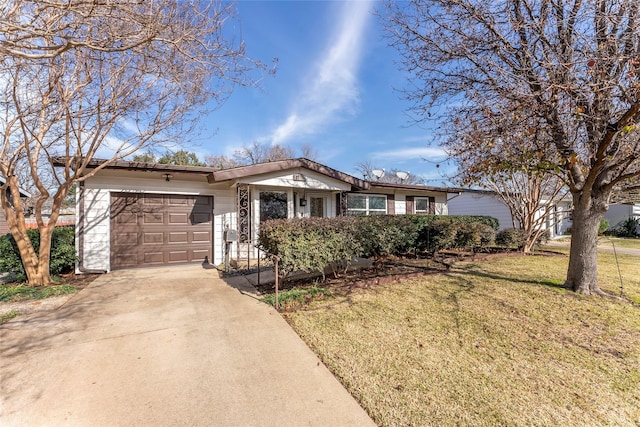 ranch-style home featuring a front yard and a garage