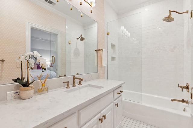 bathroom featuring ornamental molding, bathing tub / shower combination, and vanity