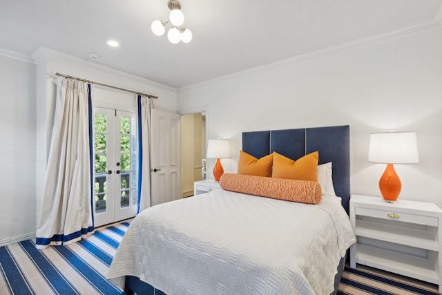 bedroom featuring french doors, an inviting chandelier, carpet floors, crown molding, and access to exterior