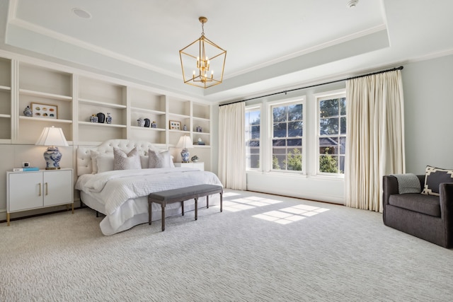 bedroom with a raised ceiling, a notable chandelier, crown molding, and carpet flooring