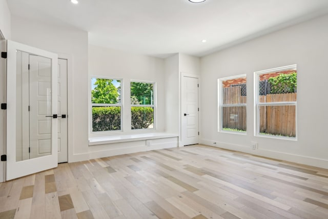 foyer entrance with light wood-type flooring