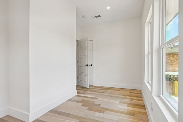 unfurnished room with light hardwood / wood-style floors