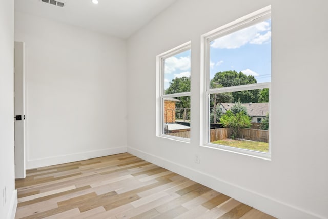 empty room with light hardwood / wood-style floors