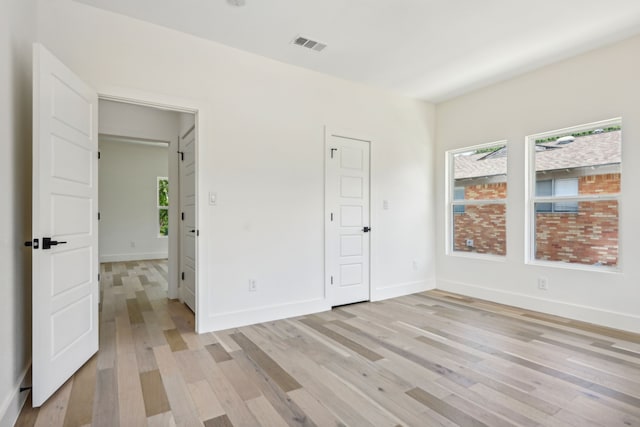 unfurnished bedroom with light hardwood / wood-style floors