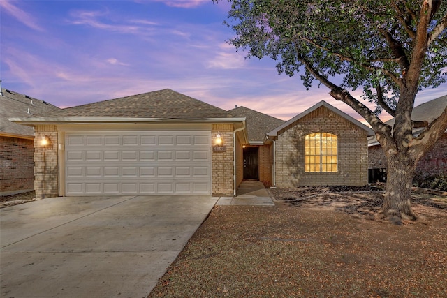 ranch-style house featuring a garage