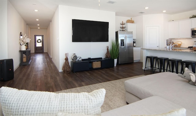 living room with dark hardwood / wood-style floors