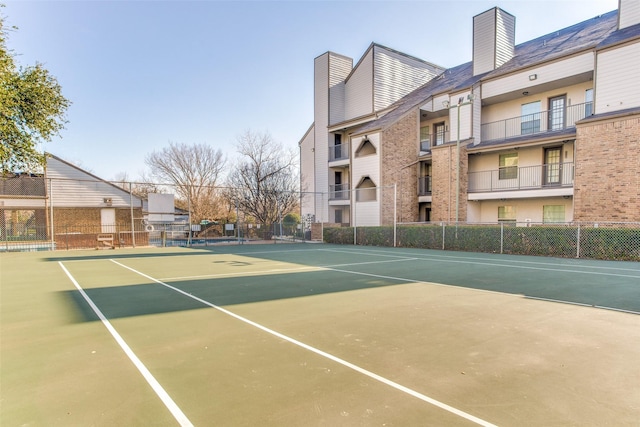 view of tennis court with basketball court