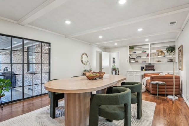 dining space featuring beamed ceiling, dark wood finished floors, visible vents, and recessed lighting