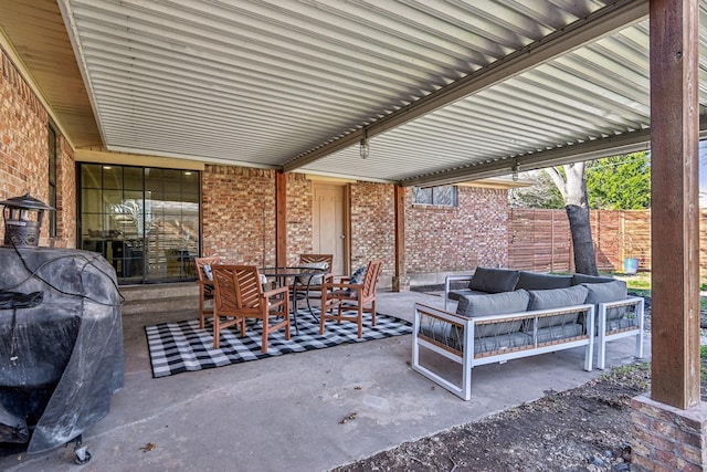 view of patio / terrace featuring fence, outdoor lounge area, and outdoor dining space