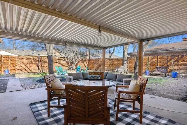 view of patio / terrace with outdoor dining space and a fenced backyard