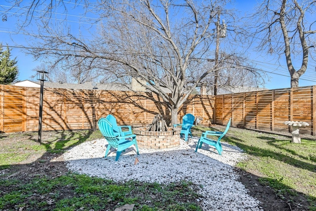 view of yard with an outdoor fire pit and a fenced backyard