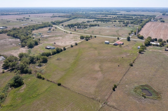 birds eye view of property featuring a rural view