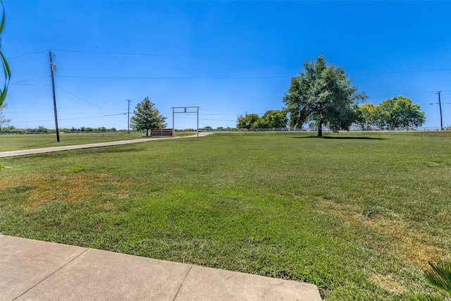 view of yard with a rural view