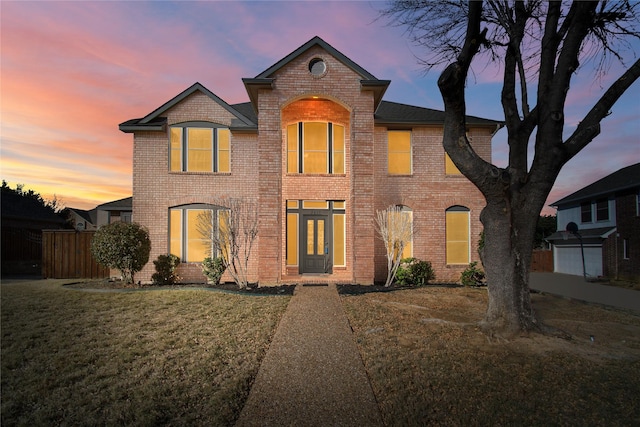 view of front of property with a yard