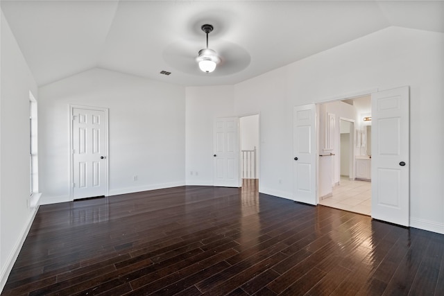 empty room featuring vaulted ceiling, ceiling fan, and hardwood / wood-style floors