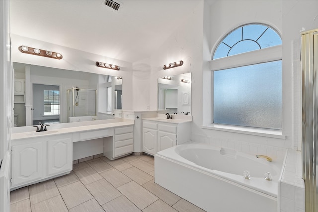 bathroom featuring plus walk in shower and vanity