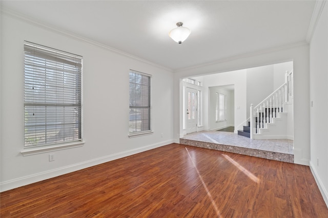 interior space with hardwood / wood-style floors and crown molding