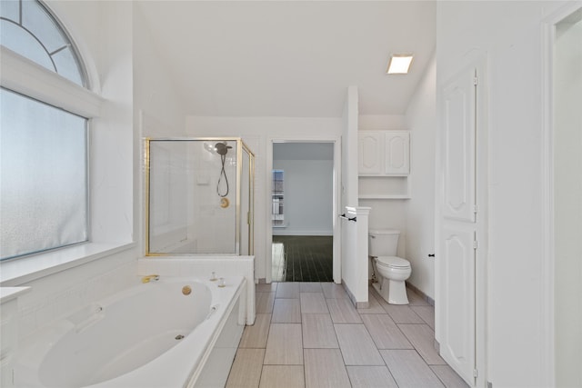 bathroom with vaulted ceiling, plus walk in shower, and toilet