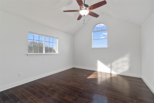 unfurnished room featuring ceiling fan, dark hardwood / wood-style flooring, and vaulted ceiling