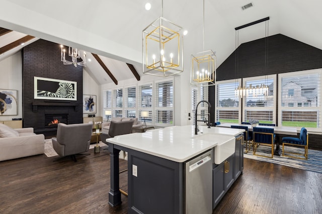 kitchen with pendant lighting, sink, a healthy amount of sunlight, and dishwasher