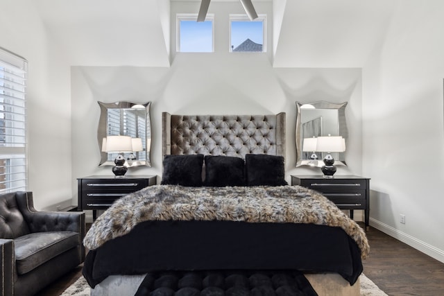 bedroom with multiple windows and wood-type flooring