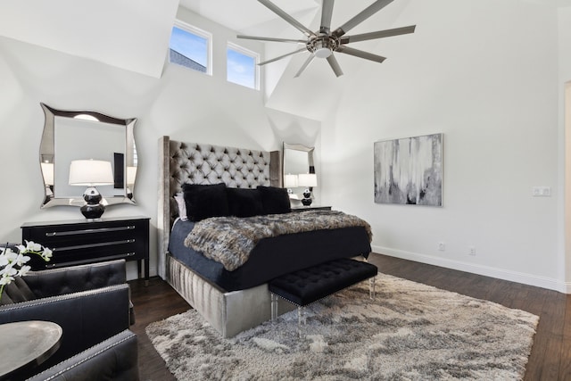 bedroom with ceiling fan, lofted ceiling, and dark hardwood / wood-style flooring