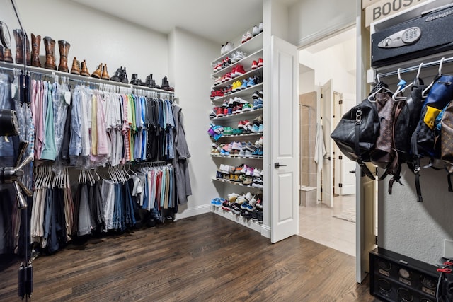 spacious closet featuring hardwood / wood-style floors