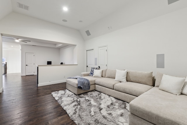 living room with ceiling fan, dark hardwood / wood-style floors, and vaulted ceiling