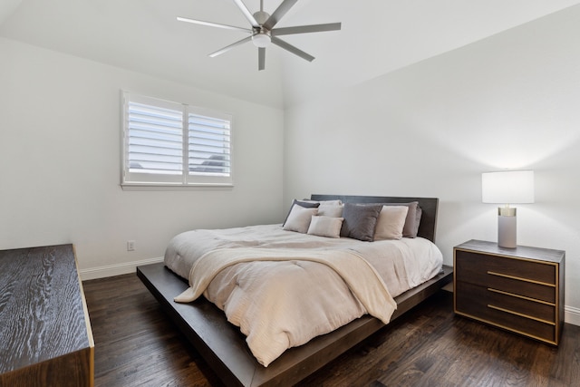 bedroom with ceiling fan, dark hardwood / wood-style flooring, and vaulted ceiling