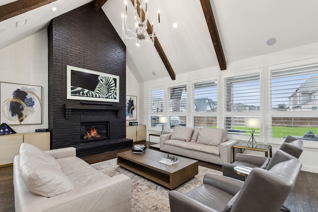 living room featuring high vaulted ceiling, a fireplace, a chandelier, hardwood / wood-style flooring, and beam ceiling