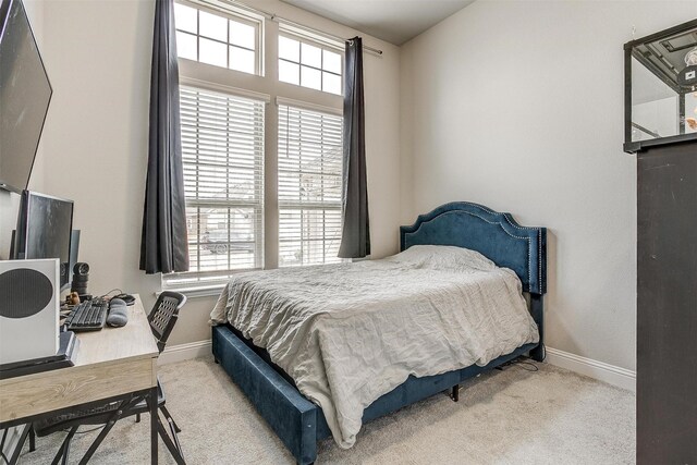 carpeted bedroom featuring vaulted ceiling