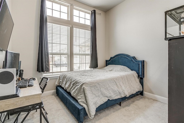 carpeted bedroom with multiple windows