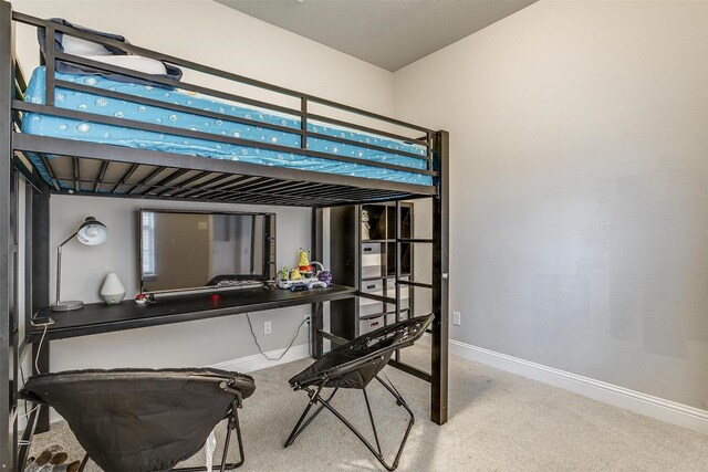 bedroom featuring a closet and carpet floors