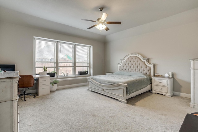 bedroom featuring ceiling fan and light colored carpet