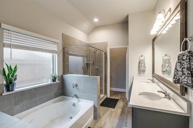 bathroom with vanity, separate shower and tub, and wood-type flooring