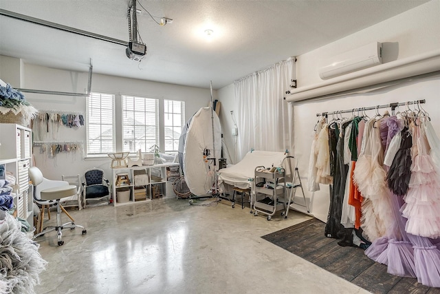 interior space featuring a wall mounted air conditioner and concrete flooring