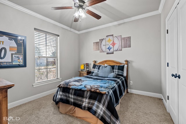 carpeted bedroom featuring multiple windows, a closet, ceiling fan, and ornamental molding