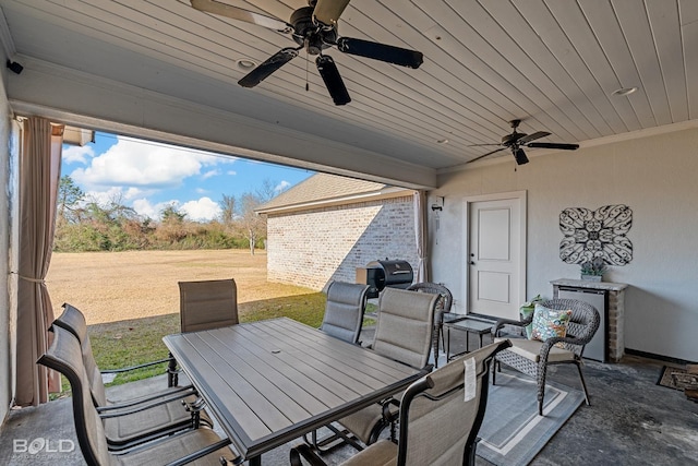 view of patio featuring ceiling fan