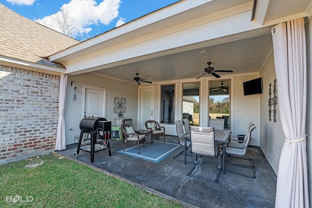 view of patio featuring ceiling fan