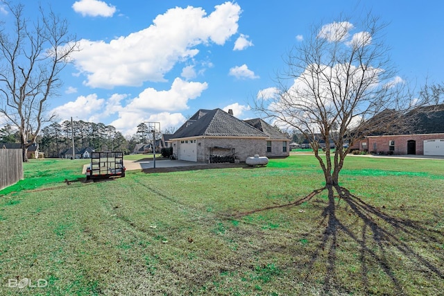 view of yard featuring a garage