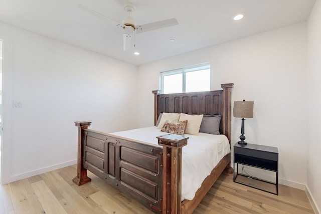 bedroom with ceiling fan and light wood-type flooring