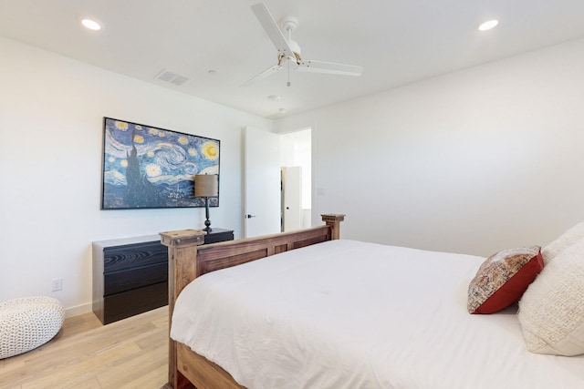 bedroom with ceiling fan and light wood-type flooring