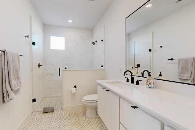 bathroom featuring walk in shower, vanity, tile patterned floors, and toilet