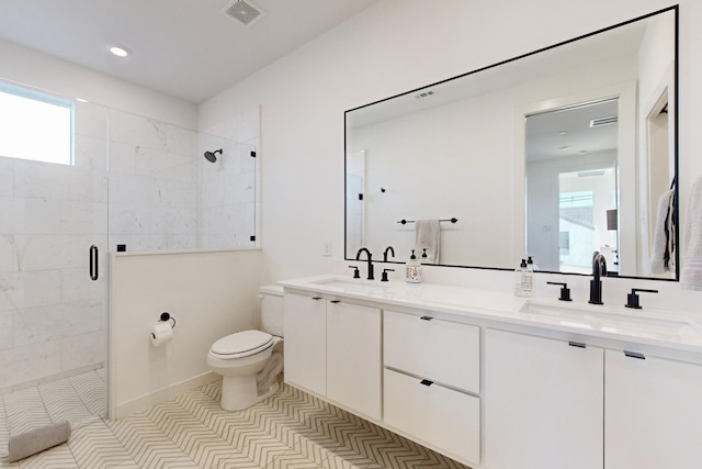 bathroom featuring tile patterned flooring, a shower with door, a wealth of natural light, and vanity