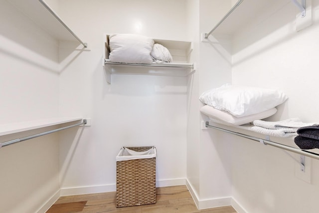 walk in closet featuring light hardwood / wood-style floors