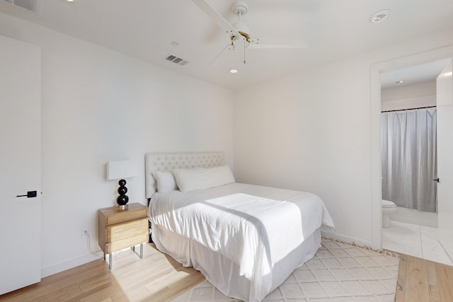 bedroom featuring ensuite bathroom, ceiling fan, and light hardwood / wood-style floors