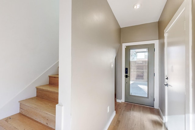 doorway with light hardwood / wood-style flooring