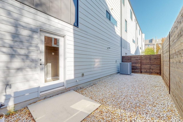 exterior space featuring a patio and central AC