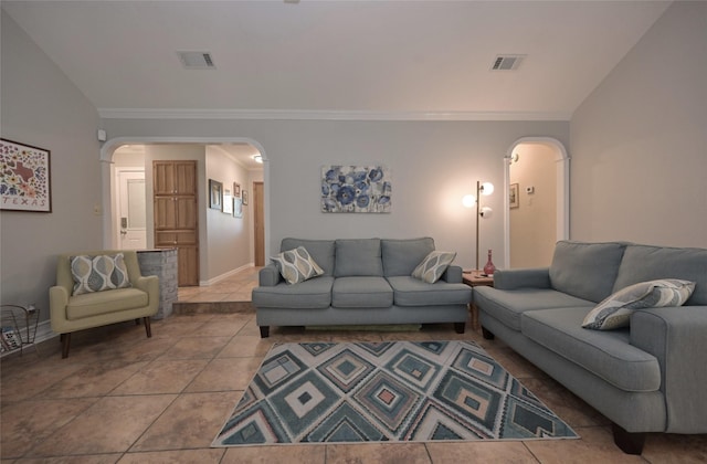 living room featuring light tile patterned flooring and crown molding