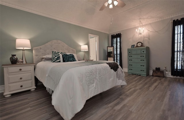 bedroom featuring a textured ceiling, vaulted ceiling, ceiling fan with notable chandelier, dark hardwood / wood-style flooring, and crown molding